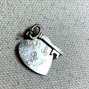 Vintage engraved heart and key pendant